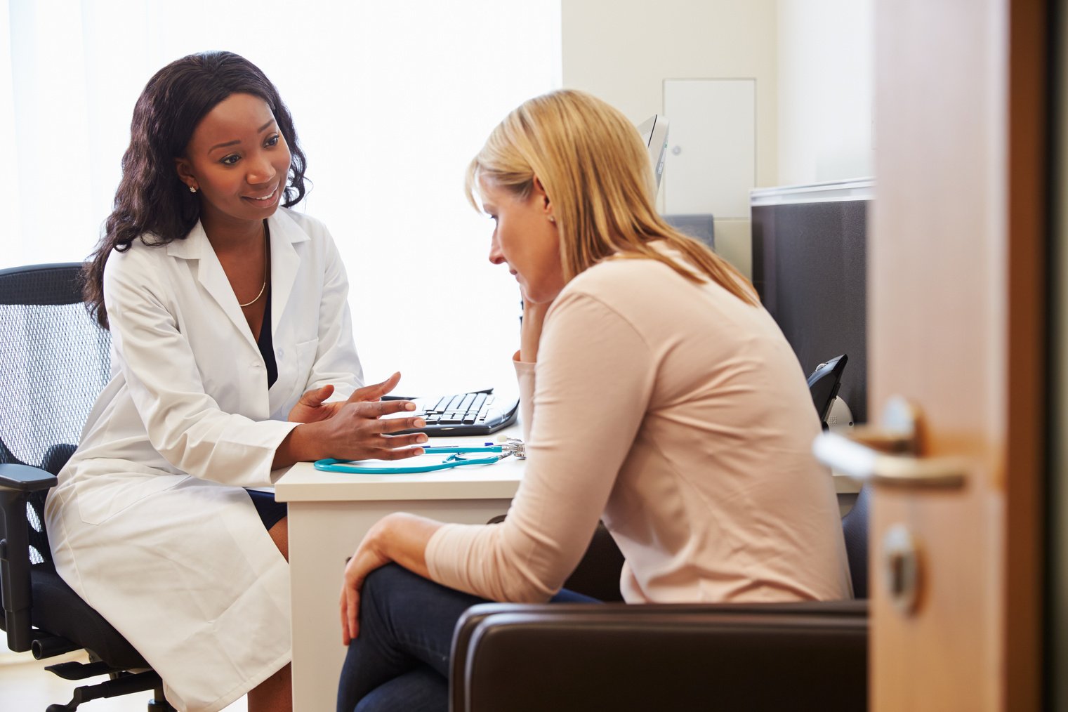 Female Doctor Treating Patient 